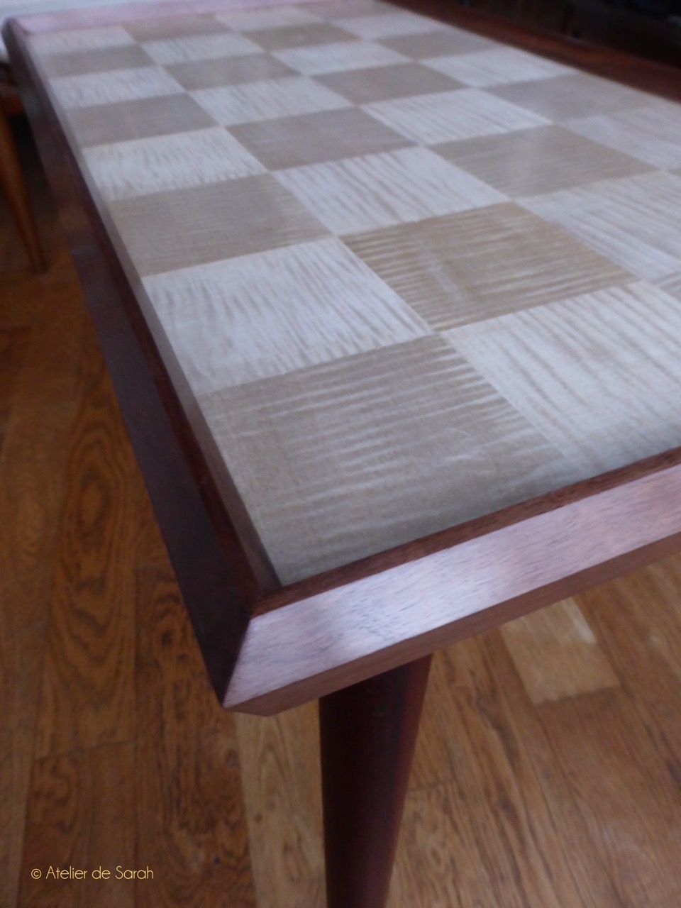 Coffee-table-with-checker-motif-in-sycamore-and-frame-edge-in-solid-walnut